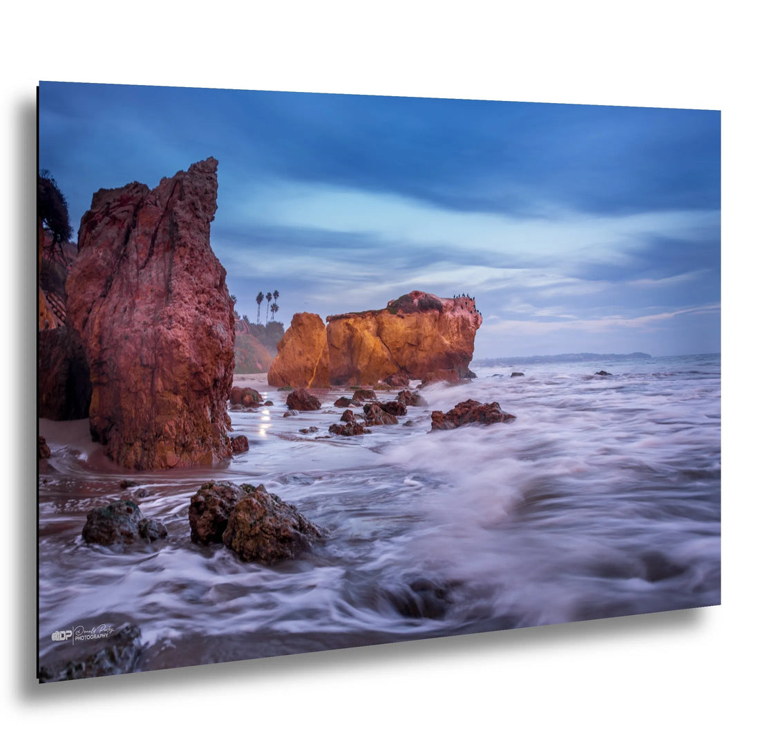 El Matador Beach Sea stacks with silky waves at sunset in Malibu California.