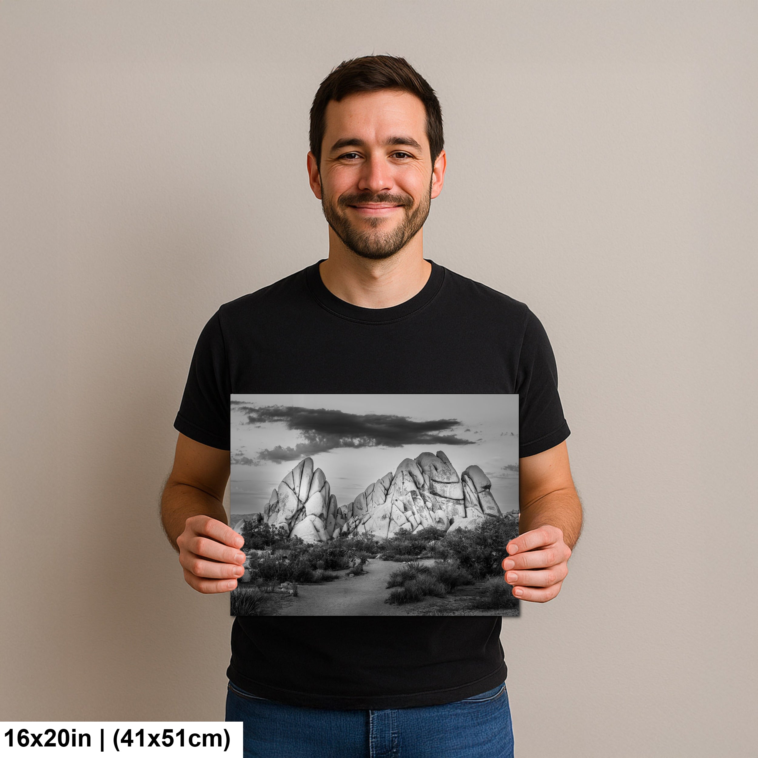 Photographer holding 16x20 inch Joshua Tree black and white landscape print.